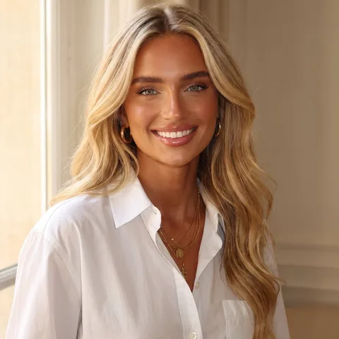 Camille, SOUL's style host, in a white shirt with gold chains